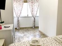 Maison Ortigiaにあるベッド