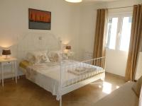 A bed or beds in a room at Ktima Pyroessa Apartments - Blue Apartment