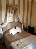 Posteľ alebo postele v izbe v ubytovaní Hotel Villa Calandrino