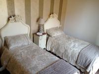 Posteľ alebo postele v izbe v ubytovaní Hotel Villa Calandrino