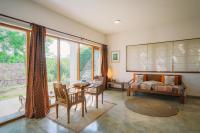 a living room with a couch and a table at Highland Villa in Weligama