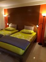 two beds sitting next to each other in a bedroom at Baan Baimai Boutique Room in Phra Nakhon Si Ayutthaya