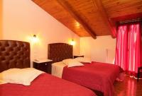 Postel nebo postele na pokoji v ubytování Hotel Varonos