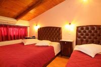 Postel nebo postele na pokoji v ubytování Hotel Varonos