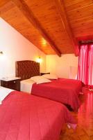 Postel nebo postele na pokoji v ubytování Hotel Varonos
