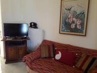 A television and/or entertainment centre at Τhe Roses House
