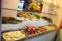 a buffet with many different types of fruits and vegetables at JR Hotel in João Pessoa