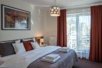 Łóżko lub łóżka w pokoju w obiekcie Apartamenty Starówka - Melody