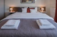 Łóżko lub łóżka w pokoju w obiekcie Apartamenty Starówka - Melody
