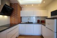Kuchnia lub aneks kuchenny w obiekcie Apartamenty Starówka - Melody