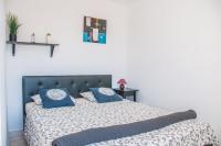 Postel nebo postele na pokoji v ubytování Cozy vacation apartment in Los Gigantes