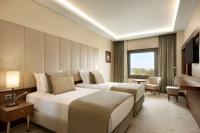 A bed or beds in a room at Ramada by Wyndham Yalova