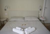 A bed or beds in a room at Aria di Casa - Navigli Darsena