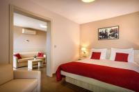 Postel nebo postele na pokoji v ubytování San Marino Resort