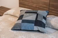 A bed or beds in a room at Carrera Home Appartamenti Verona - Bike Hotel