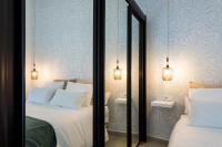 A bed or beds in a room at Apartamentos Diaber Gerona 22