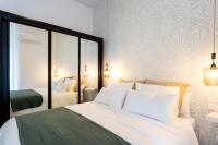 A bed or beds in a room at Apartamentos Diaber Gerona 22