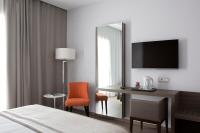Televízia a/alebo spoločenská miestnosť v ubytovaní Hotel Marad