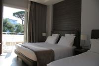 Posteľ alebo postele v izbe v ubytovaní Hotel Marad