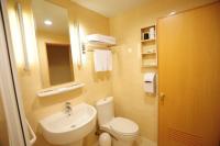 a bathroom with a white toilet and a sink at Kindness Hotel - Jhong Jheng in Kaohsiung