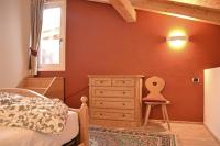 A bed or beds in a room at Casa Chatrian