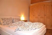 A bed or beds in a room at Casa Chatrian