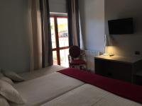 Posteľ alebo postele v izbe v ubytovaní Hotel Valjunco