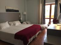 Posteľ alebo postele v izbe v ubytovaní Hotel Valjunco