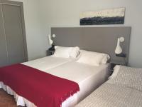 Posteľ alebo postele v izbe v ubytovaní Hotel Valjunco