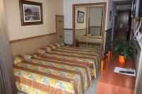 Posteľ alebo postele v izbe v ubytovaní Hotel Univers