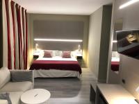 Posteľ alebo postele v izbe v ubytovaní Hotel Valjunco