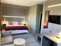 Posteľ alebo postele v izbe v ubytovaní Hotel Valjunco
