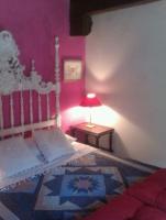 A bed or beds in a room at La Dueña I