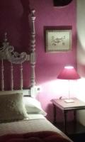A bed or beds in a room at La Dueña I