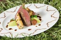 a plate of food with meat and vegetables at Hotel Montafoner Hof in Schruns-Tschagguns