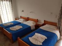 Postel nebo postele na pokoji v ubytování Drosia Hotel