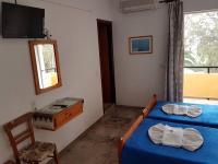 Postel nebo postele na pokoji v ubytování Drosia Hotel