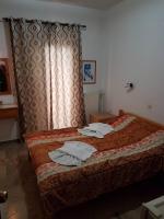 Postel nebo postele na pokoji v ubytování Drosia Hotel