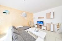 Televízia a/alebo spoločenská miestnosť v ubytovaní Apartments Gvarda