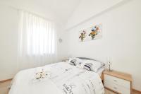Posteľ alebo postele v izbe v ubytovaní Apartments Gvarda