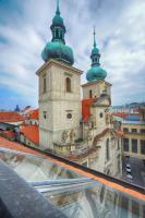 a building with two domes on top of a building at Residence St Havel Prague Old Town in Prague