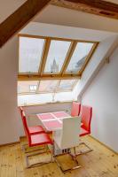 a room with a table and chairs in a attic at Residence St Havel Prague Old Town in Prague