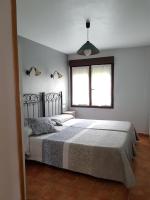 Posteľ alebo postele v izbe v ubytovaní Apartamentos Serendipia