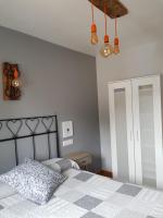 Posteľ alebo postele v izbe v ubytovaní Apartamentos Serendipia