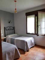 Posteľ alebo postele v izbe v ubytovaní Apartamentos Serendipia
