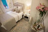 Postel nebo postele na pokoji v ubytování Hostal Casa Boutique