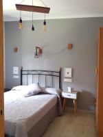 Posteľ alebo postele v izbe v ubytovaní Apartamentos Serendipia