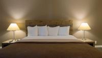 Ein Bett oder Betten in einem Zimmer der Unterkunft Thunderbird Boutique Hotel