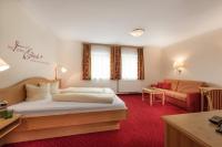 Łóżko lub łóżka w pokoju w obiekcie Das Wismeyer - Skihotel an der Plattenkarbahn