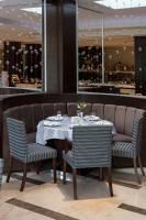 a dining room with a table and two chairs at Gabala Yengice Thermal Resort Hotel in Yengica